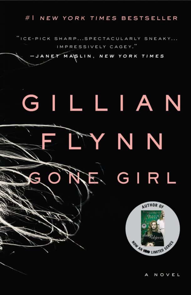 Photo of the cover of Gillian Flynn's novel Gone Girl featuring a black backgroud with whisps of blong hair running off the side